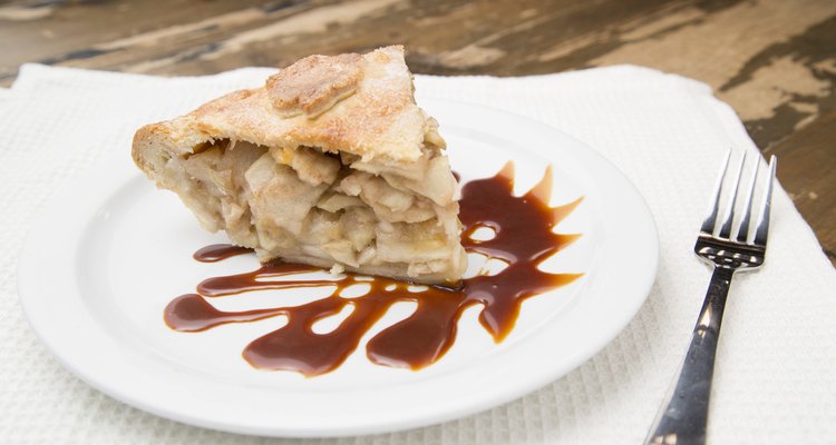 A slice of classic apple pie with a caramel glaze.