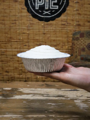 A mouthwatering pie elegantly presented on a tin plat. A sense of warmth and comfort, inviting one to savor each delicious bite.