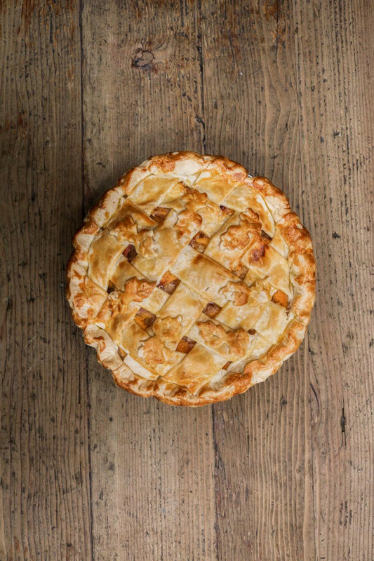 Republic of pie Peach cobbler pie placed on a wooden table.-4