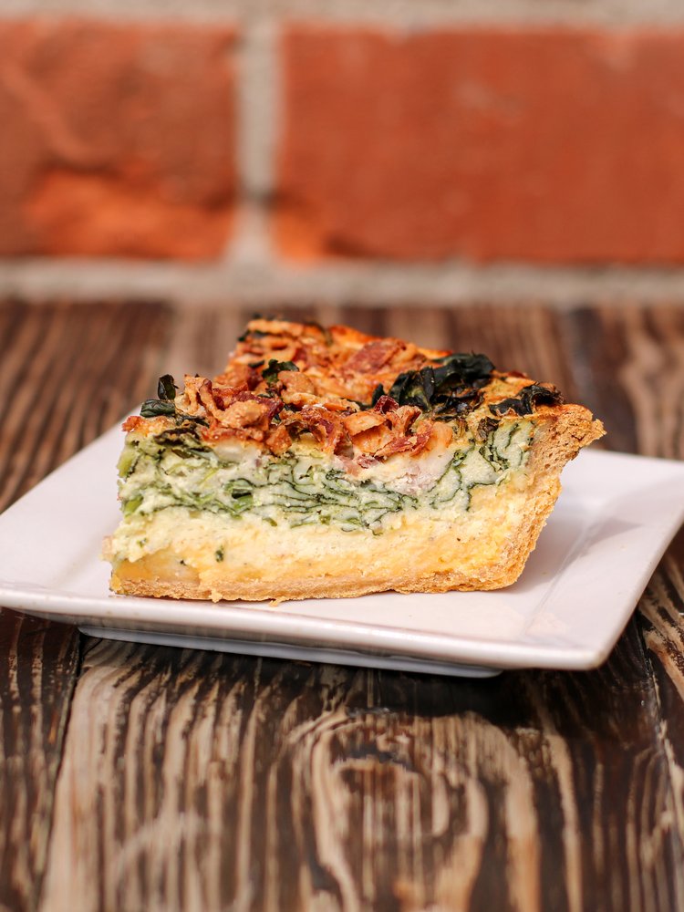 A savory delight with our Bacon Cheddar Quiche, where the rich flavors of cheddar cheese and crispy bacon come together in perfect harmony.