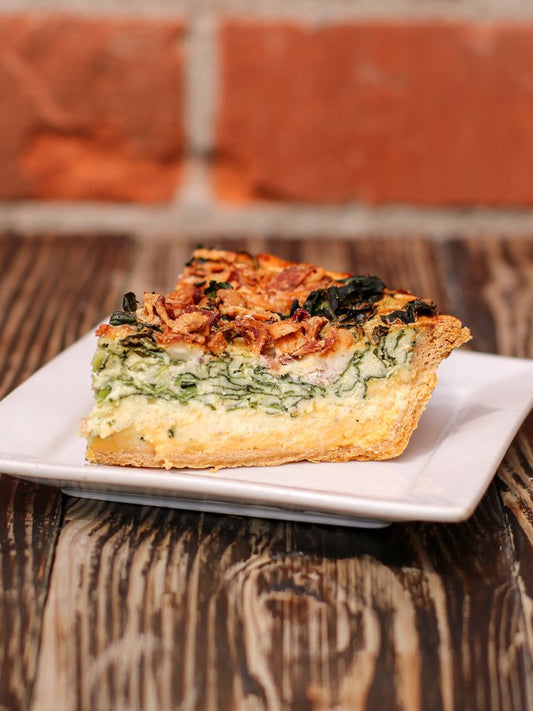 A savory delight with our Bacon Cheddar Quiche, where the rich flavors of cheddar cheese and crispy bacon come together in perfect harmony.