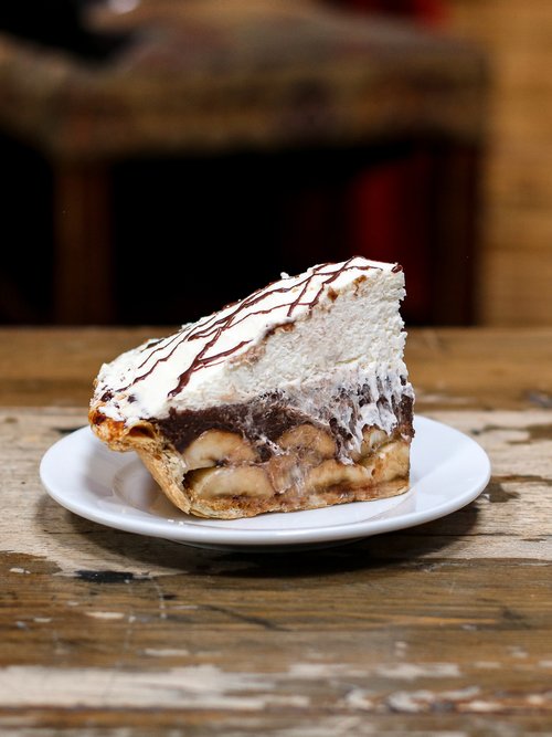 An unbeatable combination featuring rich melted chocolate, freshly chopped bananas, and cream whipped to perfection.
