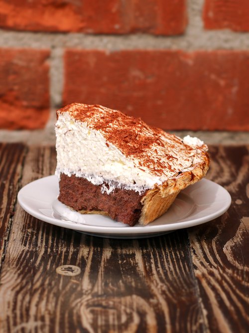 ROp homemade chocolate cream pie. With its irresistible creamy filling and decadent chocolate flavor.