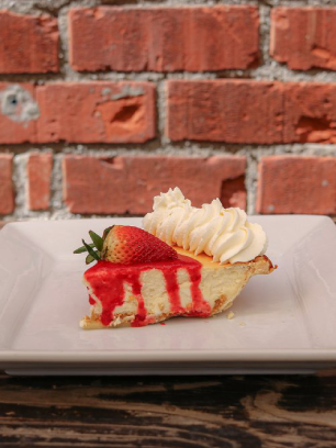 A combination of a creamy berry cheesecake baked within a flaky pie crust and generously covered in a luscious berry sauce available at Republic of Pie.