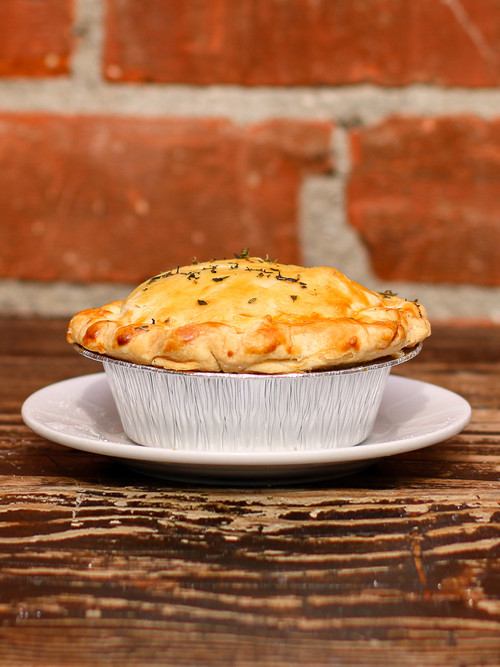 Savor the comforting flavors of chicken pot pie, filled with tender chicken, onions, sweet peas, corn, carrots, and mushrooms. 